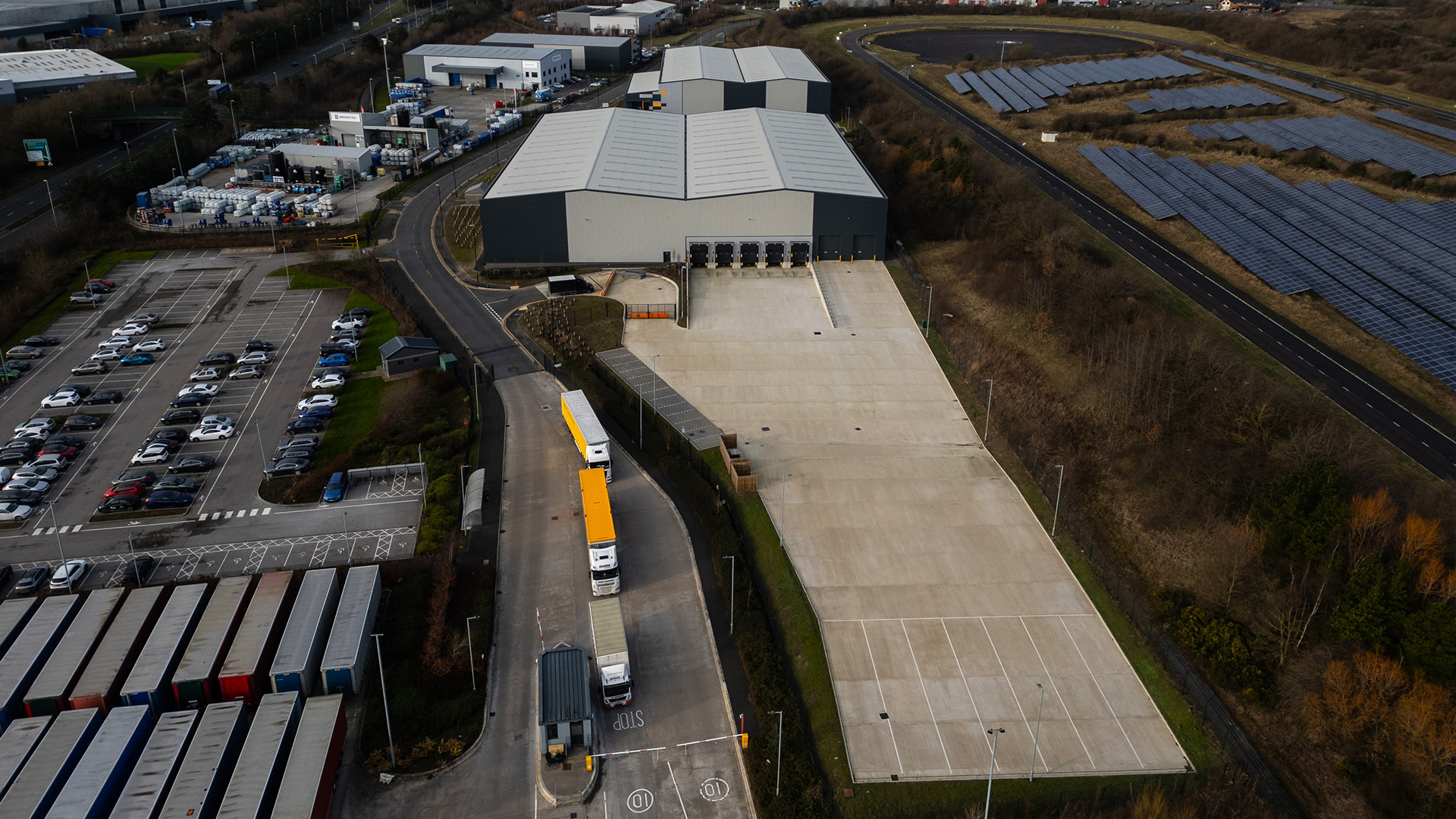 TB51 industrial warehouse unit and car park. CGI.